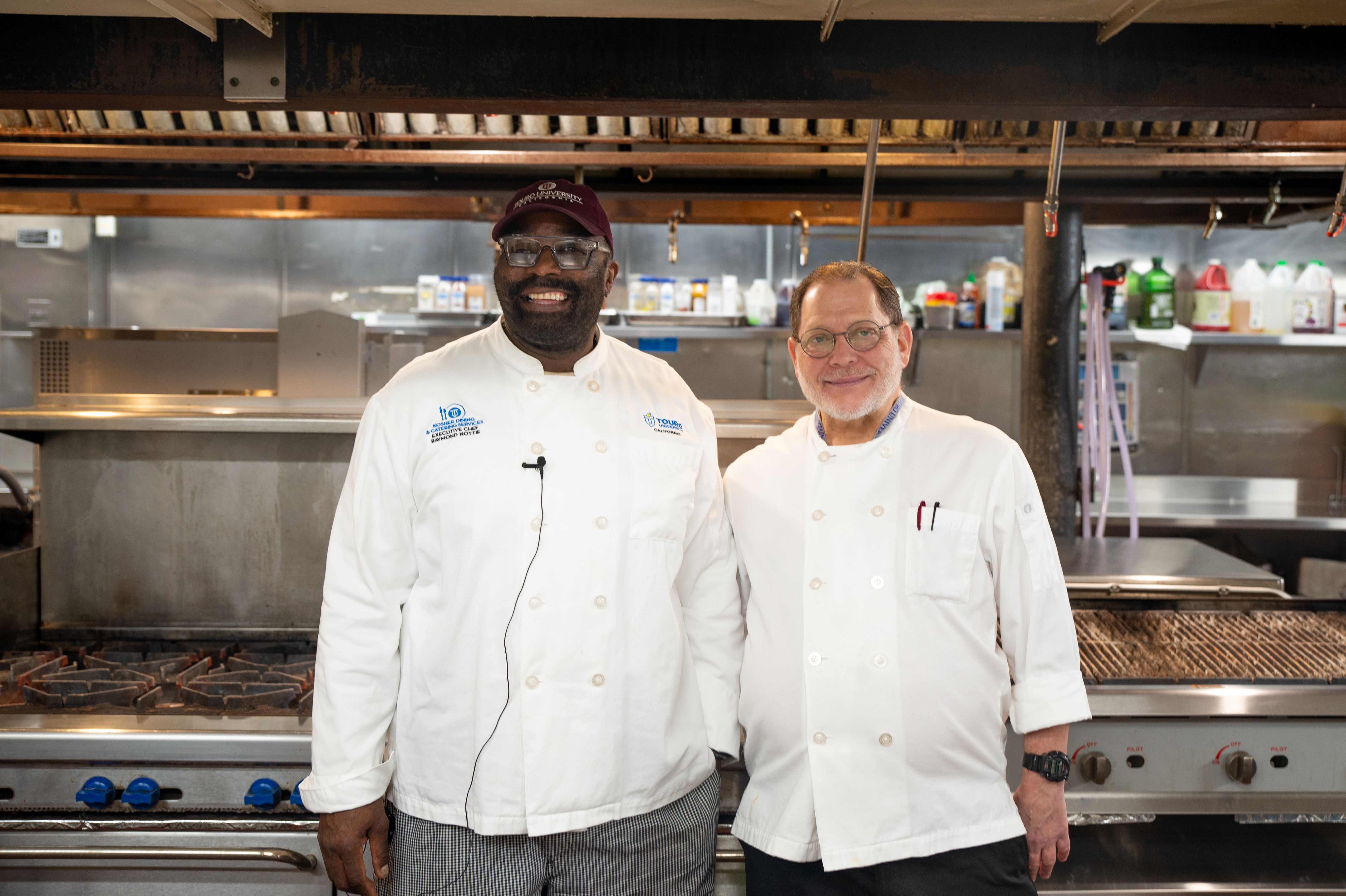 Chef Ray Nottie (left) stands next to Mashgiach Kalman Winnick (right) inside the TUC Kitchen where meat is cooked.