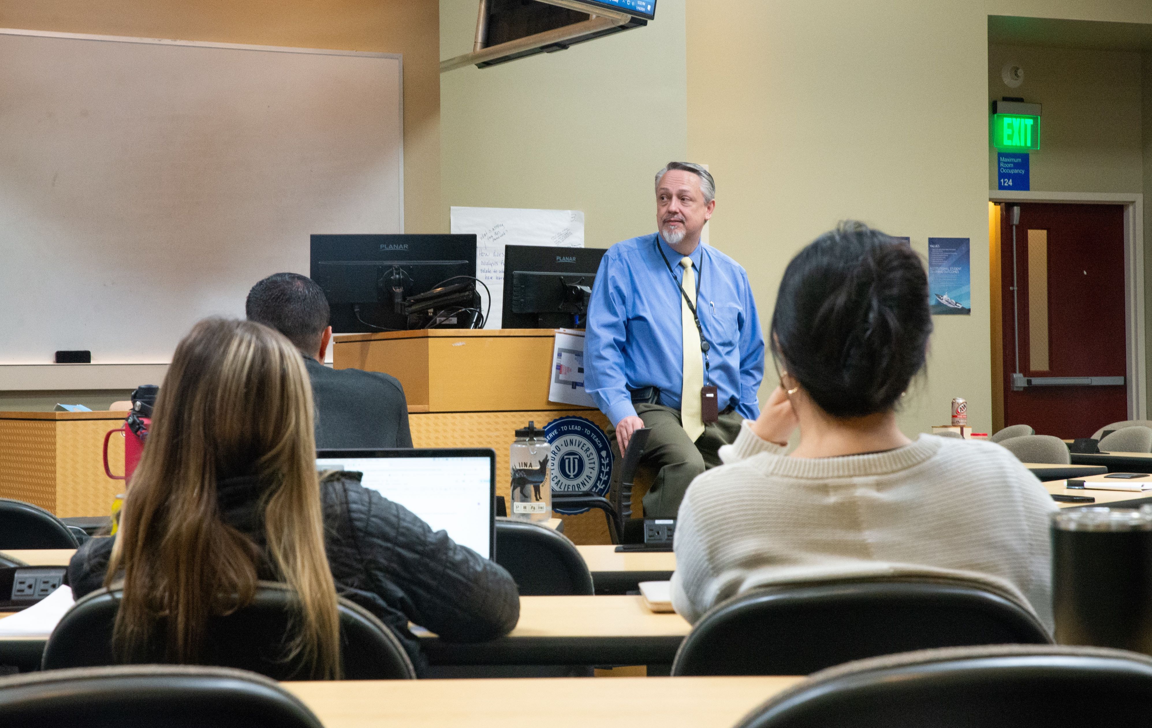 Dr. Jim Scott, Dean of the College of Pharmacy stands in front of a classroom full of students