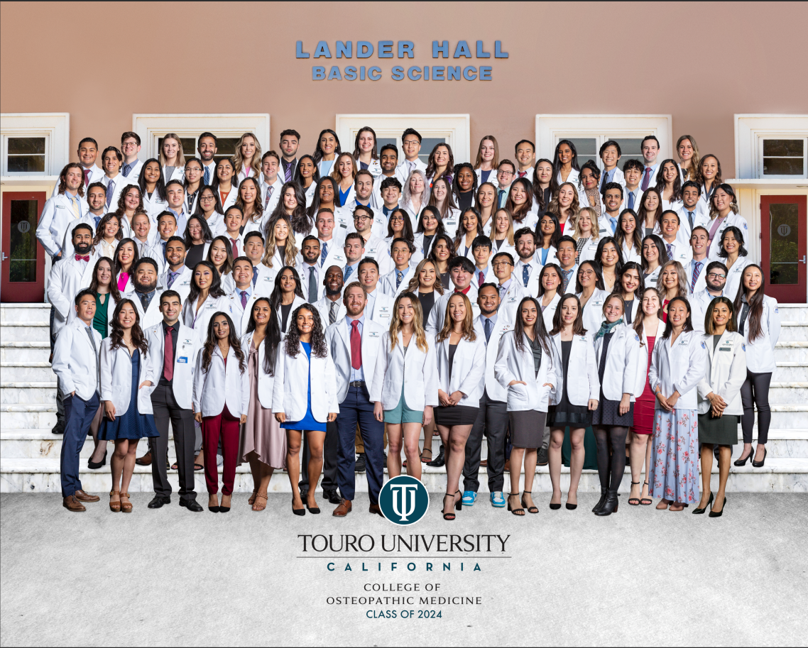 A large group of student doctors standing in front of Touro California University\'s Lander Hall