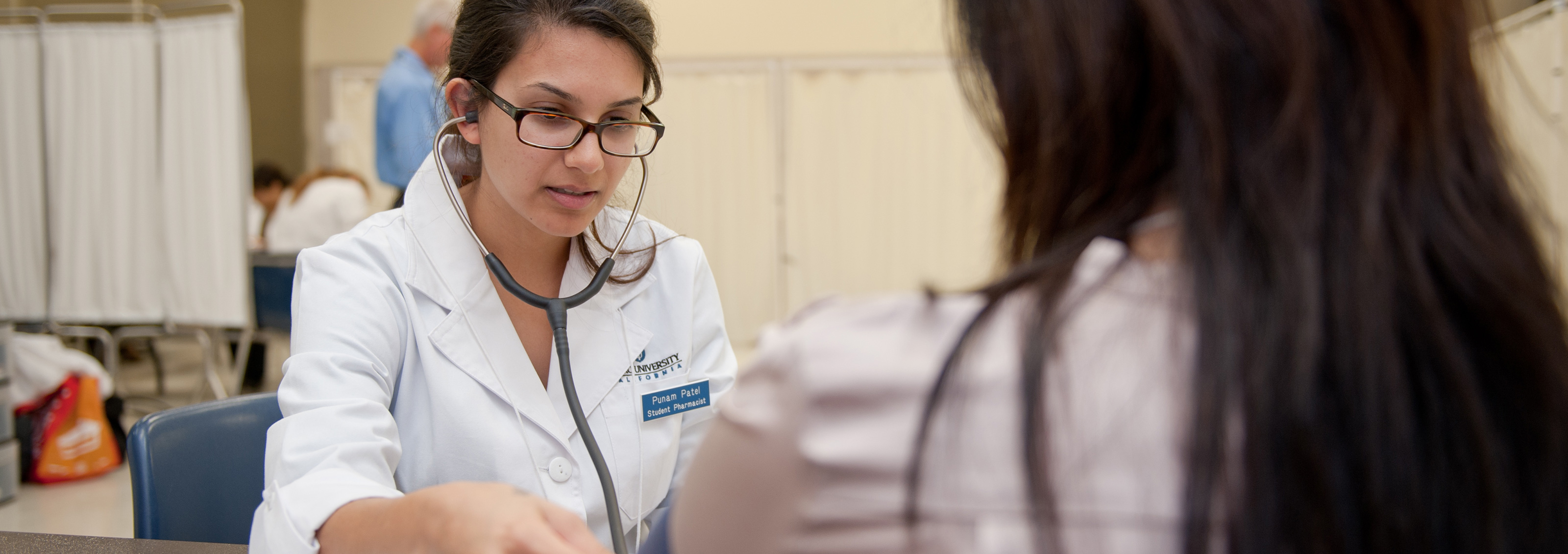 Female Doctor treating a female patient