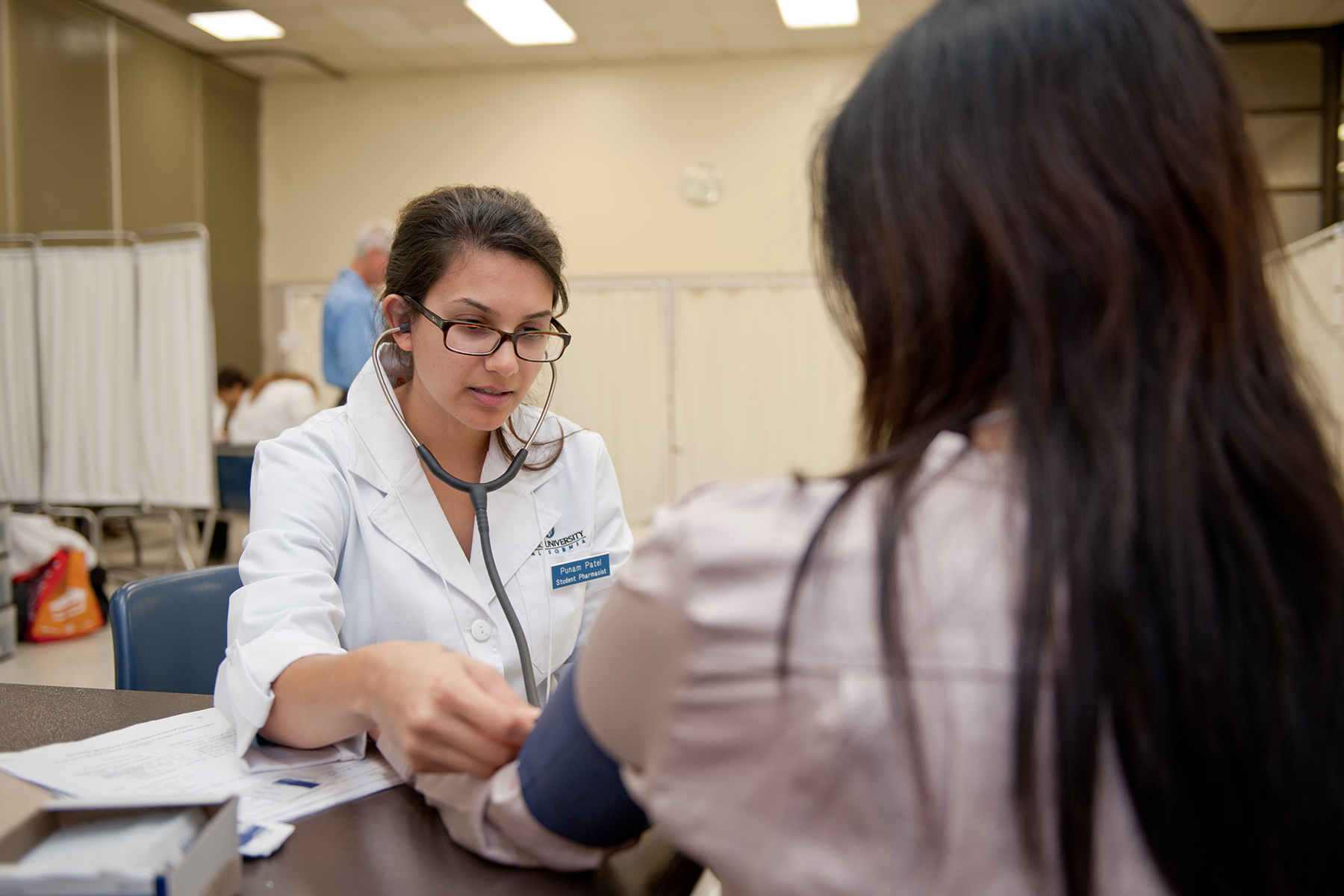 Female Doctor treating a female patient