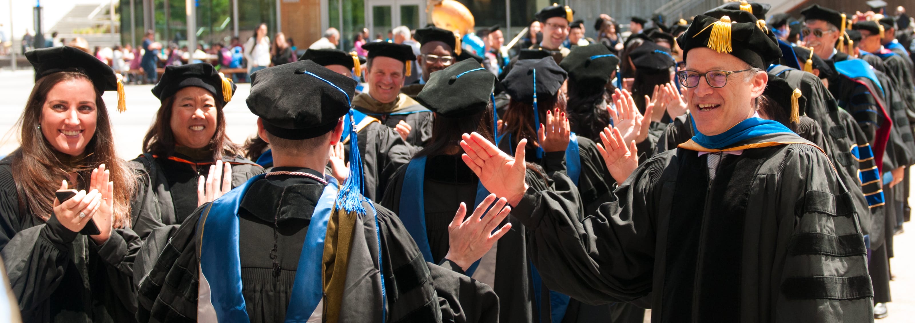 Group of students in caps and gowns at graduation