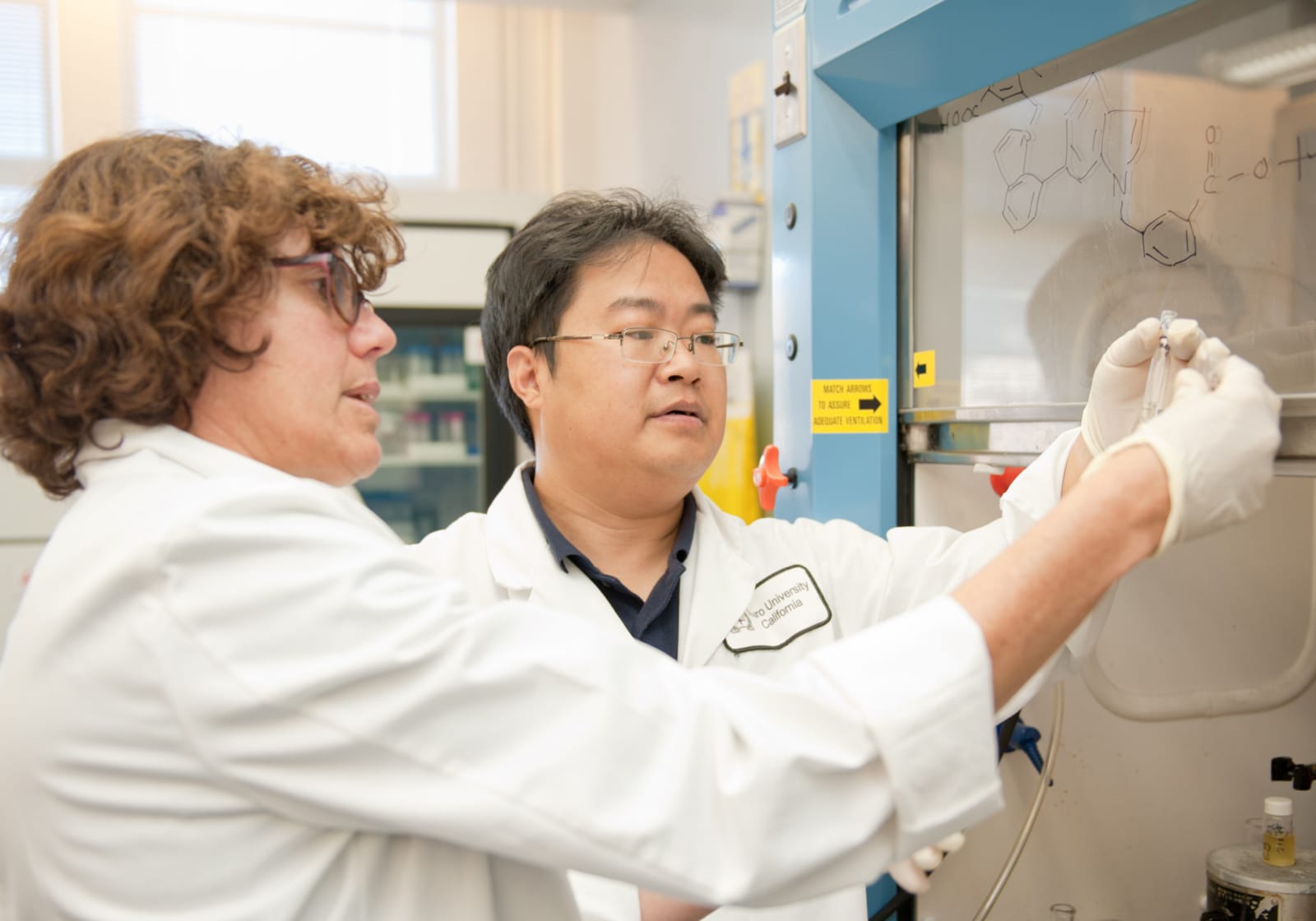 two TUC researchers in chemistry lab