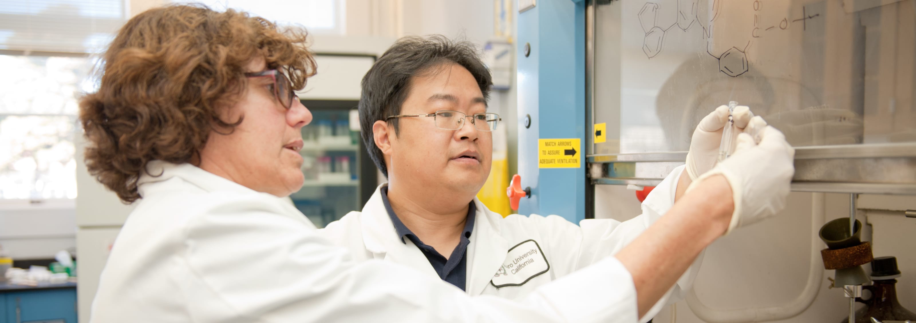 two TUC researchers in chemistry lab