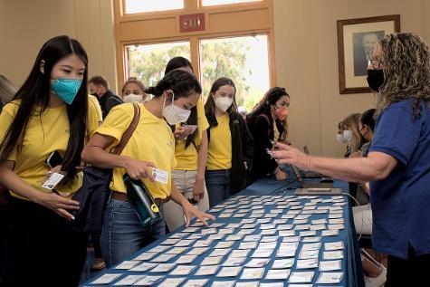 Students browse for their ID badges.