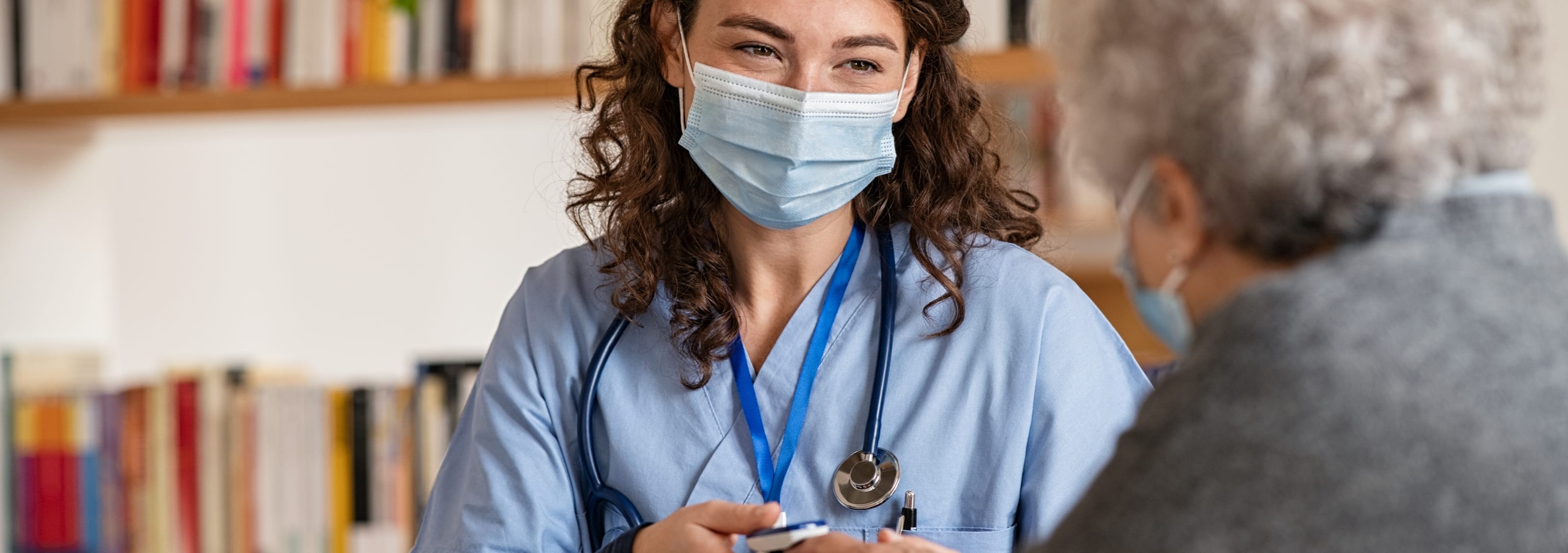 female doctor taking patient's blood oxygen