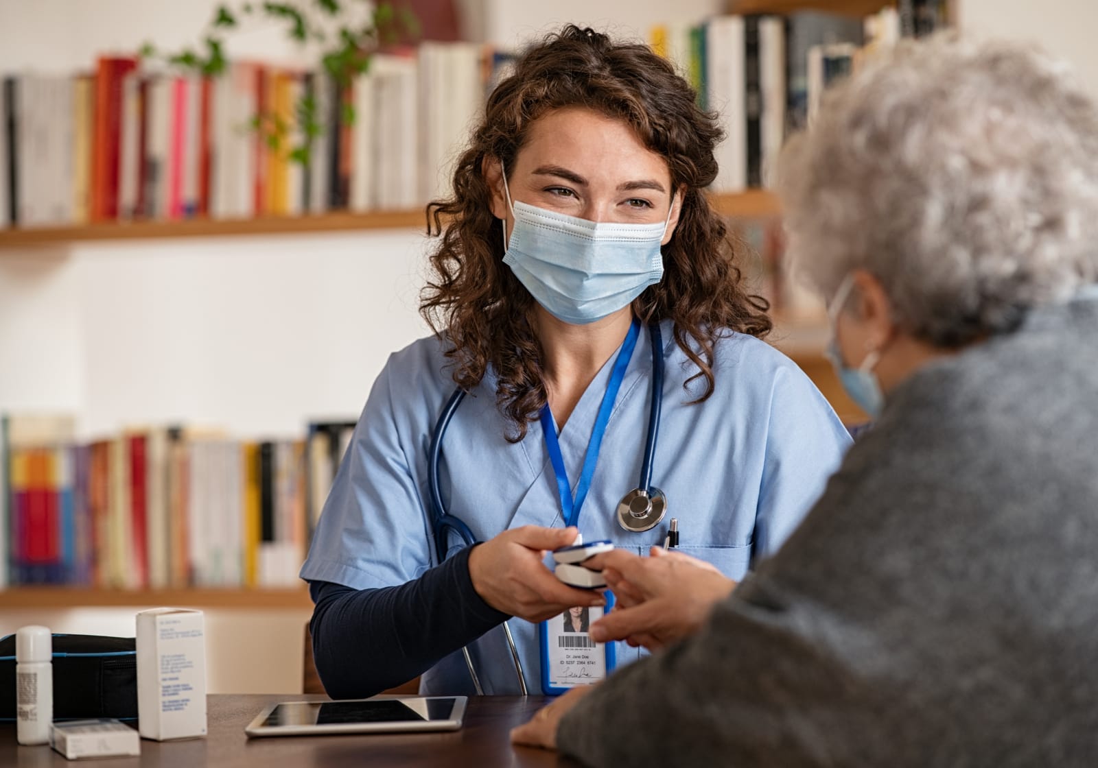 female doctor taking patient\'s blood oxygen