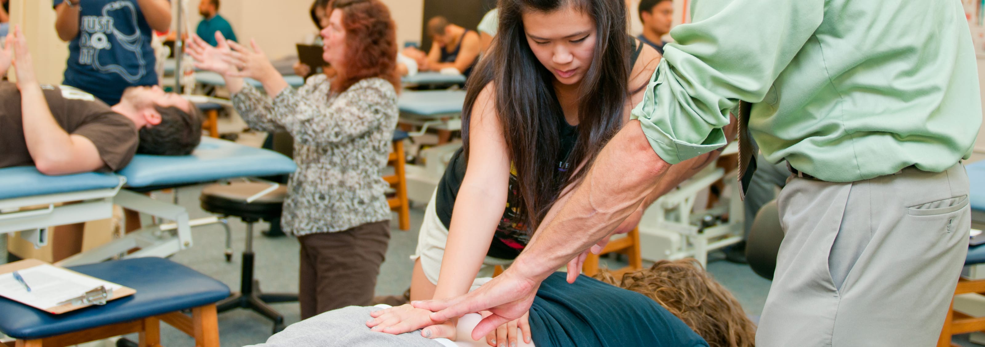 Students and teachers studying in a clinical setting