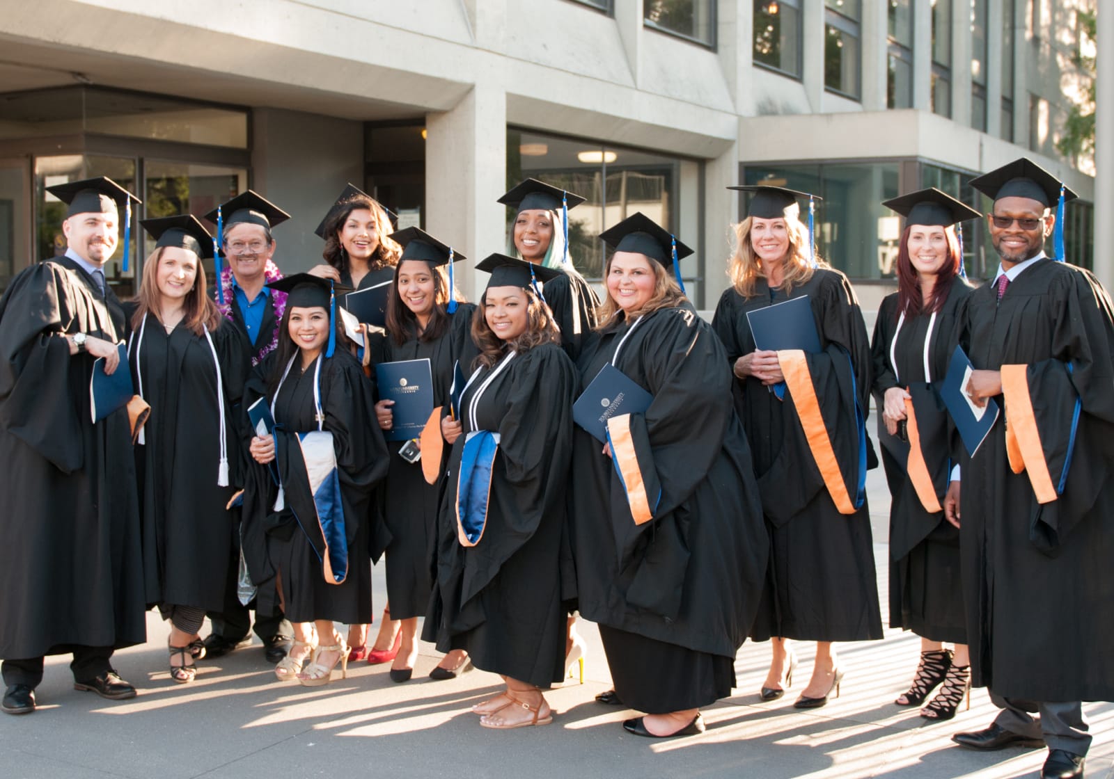 group shot of TUC nursing graduates in caps and gowns