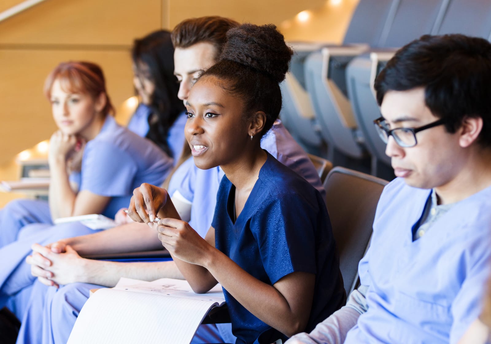 healthcare professionals sitting in a lecture