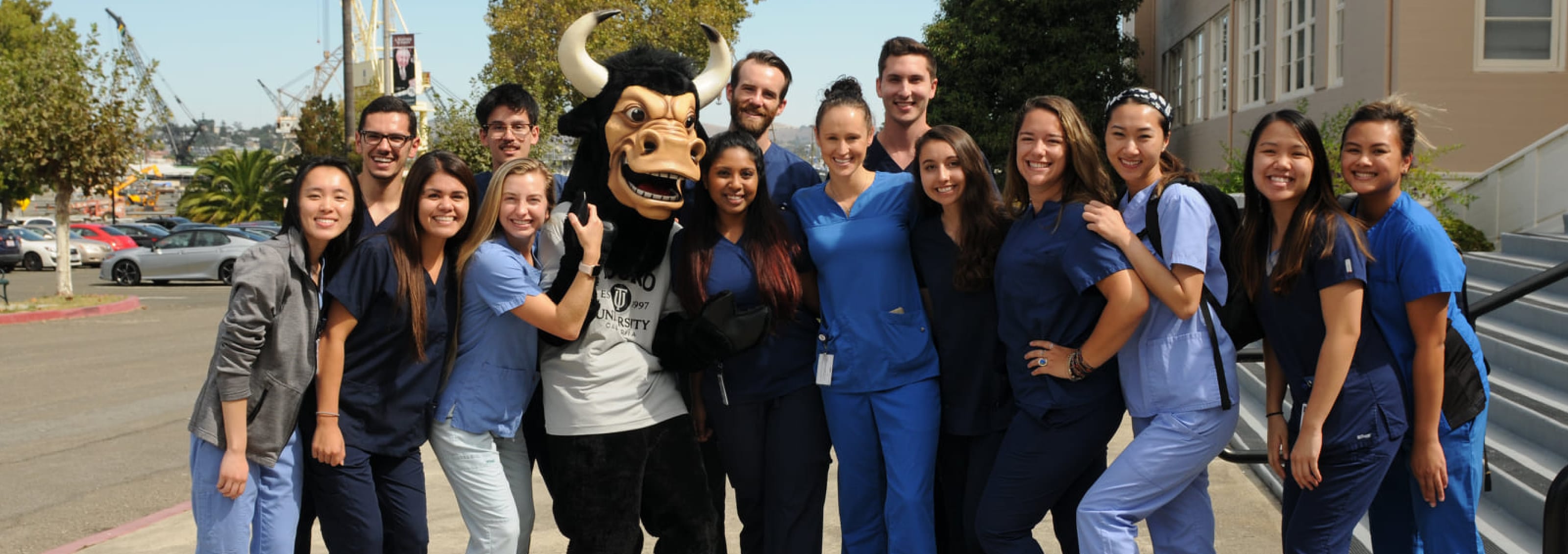 group shot of PA students posing with school mascot