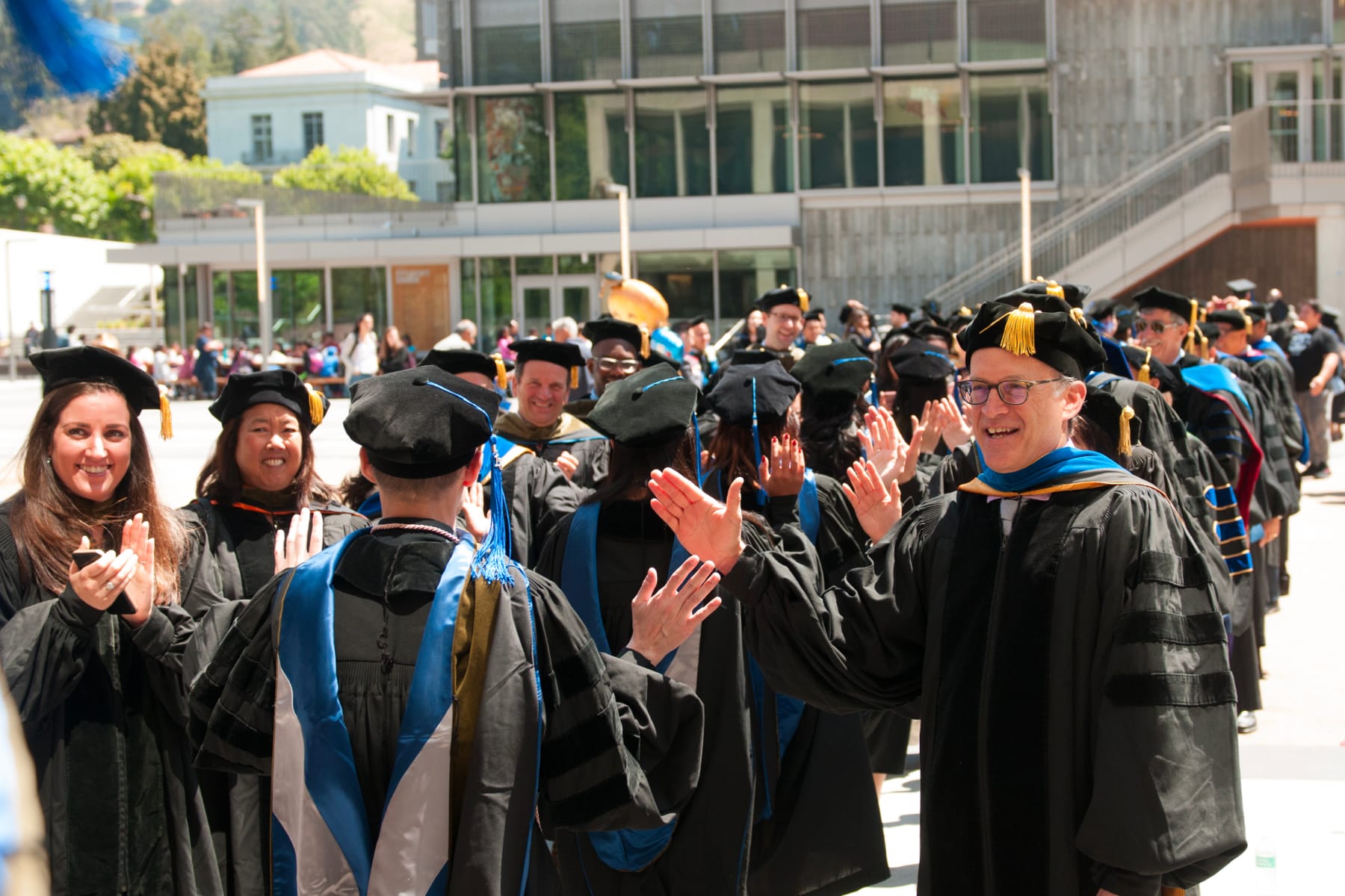 Group of students in caps and gowns at graduation