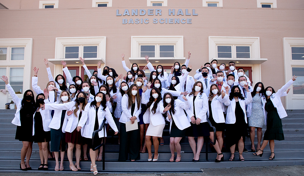 Physician Assistant Class of 2023 pose for a group photo in front of Lander Hall