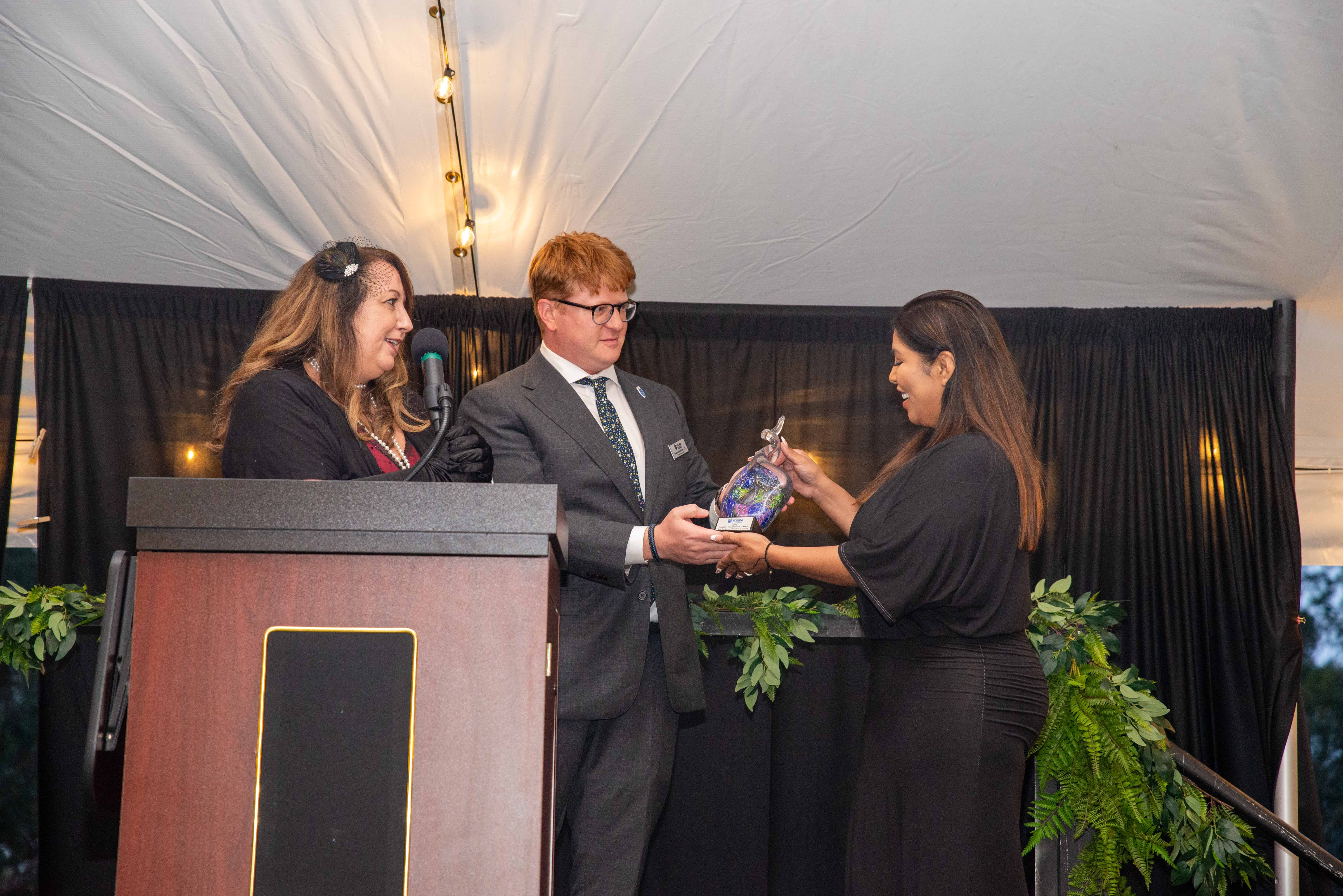 Dr. Tami Hendriksz and VP Newman Hoffman present the Mosaic Achievement Award to Yocha Dehe Wintun Nation.