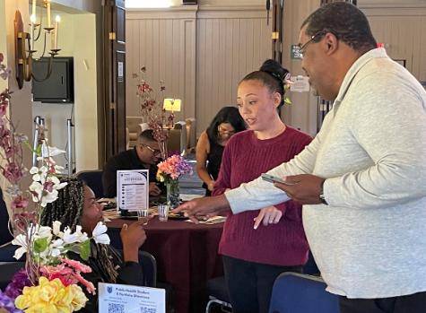 A photo shows a pair of community partner representatives as they visit with Kevin Williams, Assistant Professor with the MPH program and an attorney, right, during the Public Health Program\'s Community Partner Reception in the Farragut Inn on campus, Thursday, June 25, 2026.