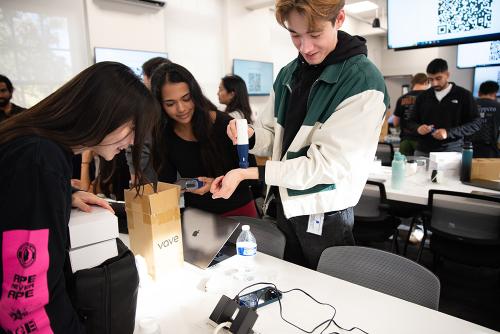 First-year students testing the capabilities of handheld ultrasound during the distribution event