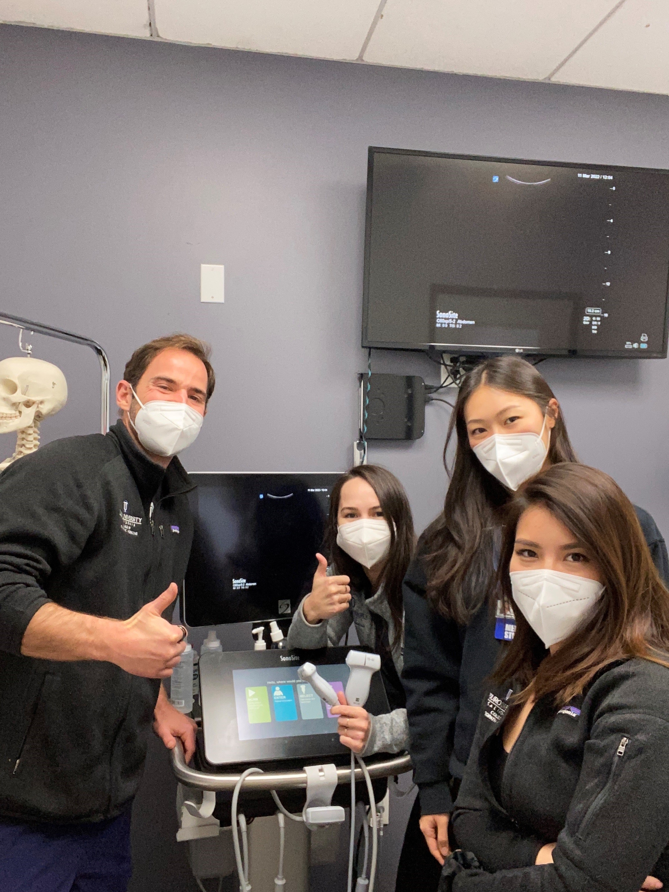 A group of Touro students inside an ultrasound lab. 